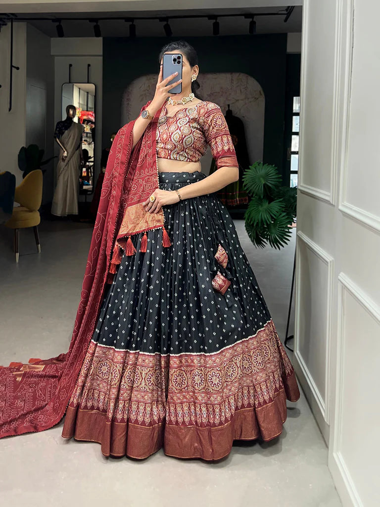 BLACK COLOR BANDHANI AND AJRAKH PRINT WITH FOIL WORK DOLA SILK CHANIYA CHOLI