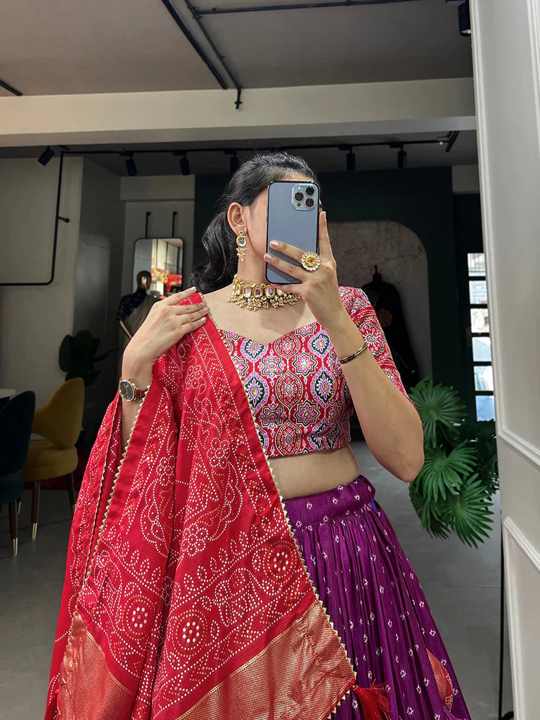 PURPLE COLOR BANDHANI AND AJRAKH PRINT WITH FOIL WORK DOLA SILK CHANIYA CHOLI